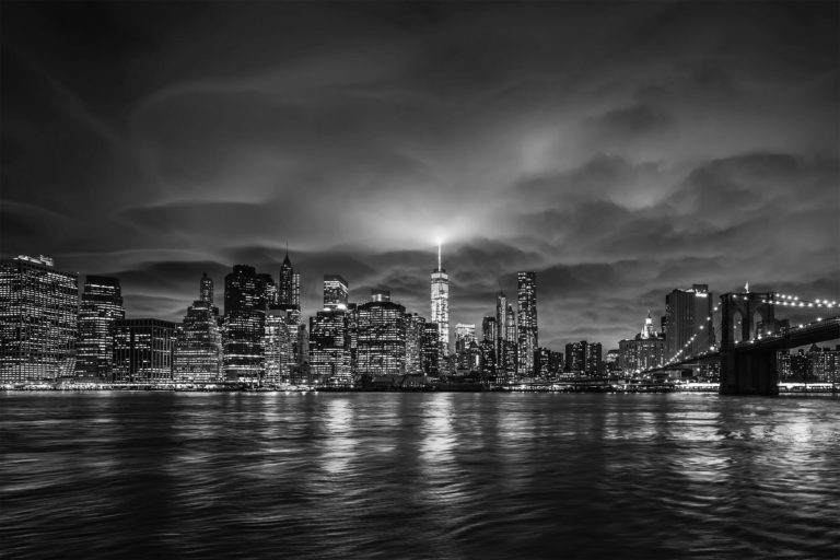 night shot of a city from the water